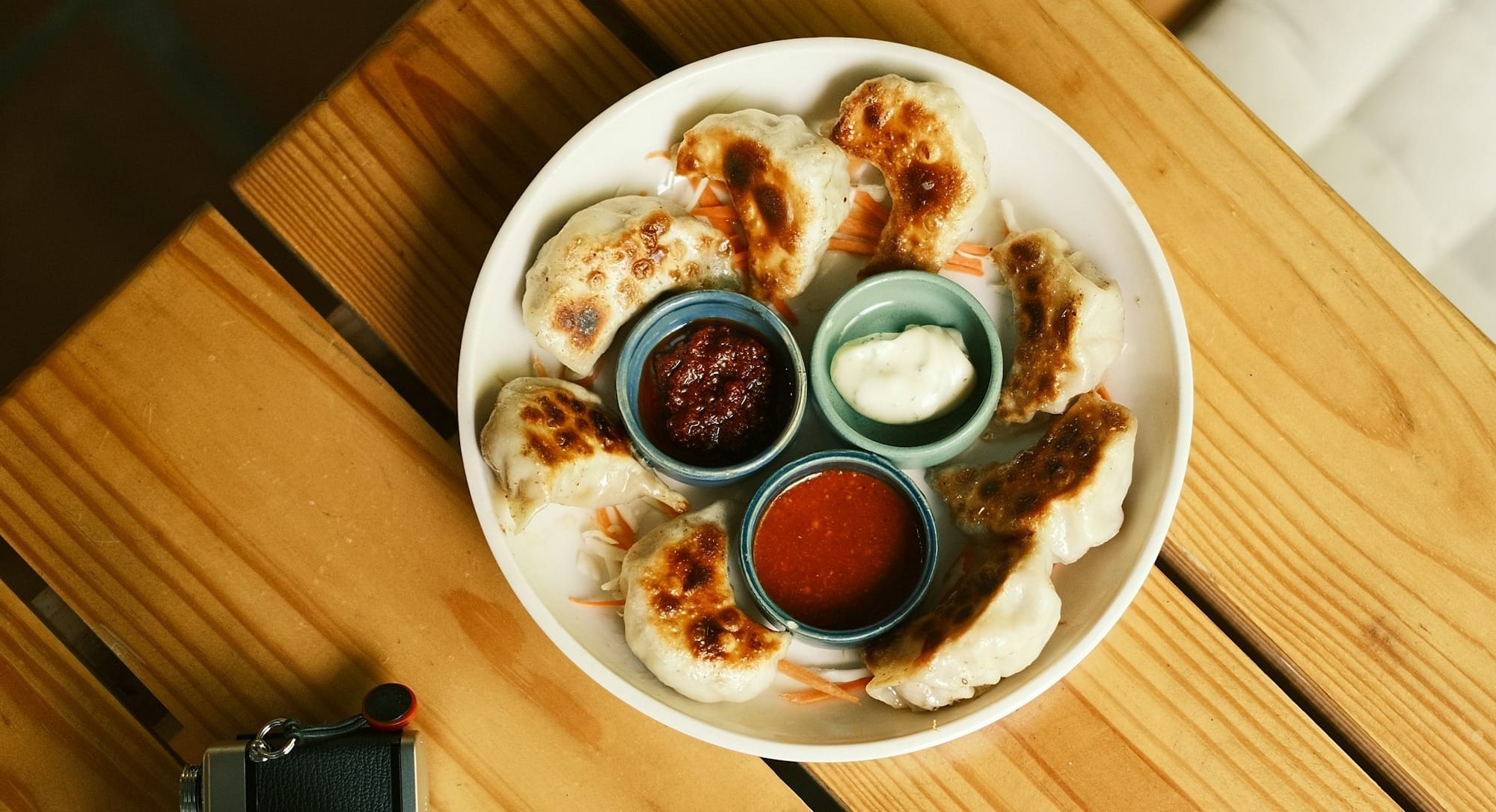 a plate of food on a wooden table